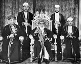 Sayyid Sir Khalifa II bin Harub Al-Said, GCB, GCMG, GBE (August 26, 1879 – October 9, 1960) (Arabic: خليفة بن حارب البوسعيد‎) was the ninth Sultan of Zanzibar. He ruled Zanzibar from December 9, 1911 to October 9, 1960.<br/><br/>

Sayyid Sir Abdullah bin Khalifa Al-Said, KBE, CMG (February 12, 1910 – July 1, 1963) (Arabic: عبد الله بن خليفة‎) was the 10th Sultan of Zanzibar. He ruled Zanzibar from October 9, 1960 to July 1, 1963.<br/><br/>

Sayyid Sir Jamshid bin Abdullah Al Said GCMG, (Arabic: جمشيد بن عبد الله‎) (born September 16, 1929 in Zanzibar) was the last Sultan of Zanzibar. He ruled Zanzibar from July 1, 1963 to January 12, 1964.